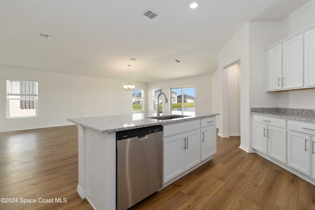 kitchen with stainless steel dishwasher, white cabinetry, sink, and hardwood / wood-style flooring