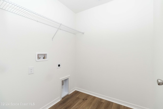 washroom featuring electric dryer hookup, dark hardwood / wood-style flooring, and hookup for a washing machine