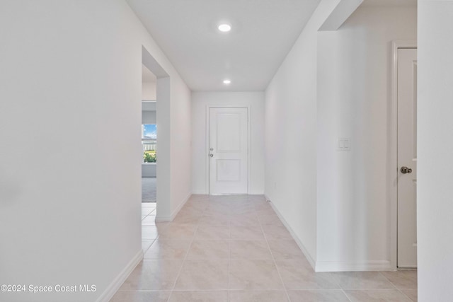 3480 Aramore Rd SE, Palm Bay, FL 32909 - hallway with recessed lighting, baseboards, and light tile patterned flooring