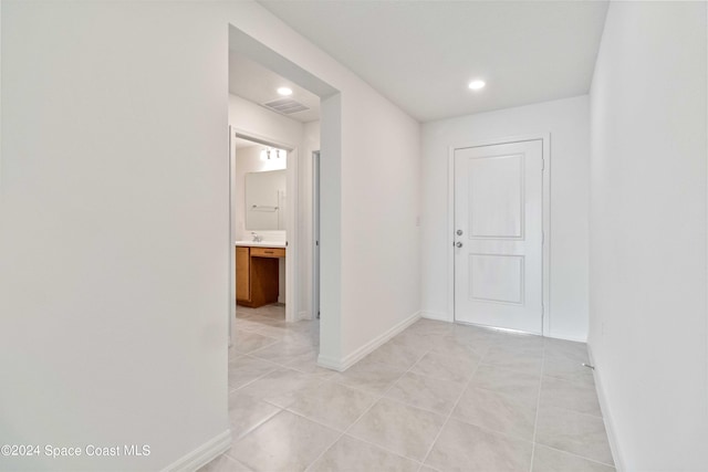 3480 Aramore Rd SE, Palm Bay, FL 32909 - hallway with recessed lighting, baseboards, visible vents, and light tile patterned floors