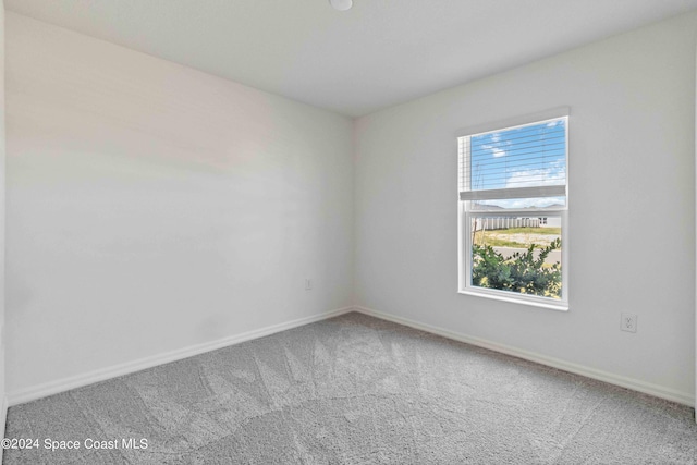 3480 Aramore Rd SE, Palm Bay, FL 32909 - carpeted spare room featuring baseboards