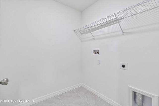 3480 Aramore Rd SE, Palm Bay, FL 32909 - laundry room featuring hookup for an electric dryer, light tile patterned floors, baseboards, laundry area, and washer hookup
