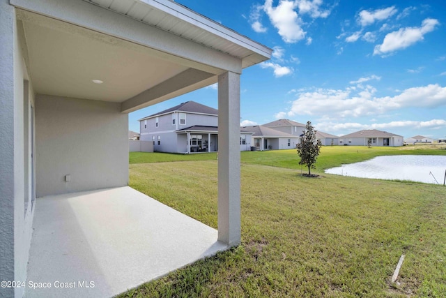 3480 Aramore Rd SE, Palm Bay, FL 32909 - view of yard featuring a patio area, a water view, and a residential view