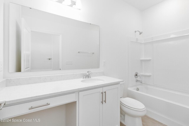 full bathroom with vanity, shower / washtub combination, and toilet