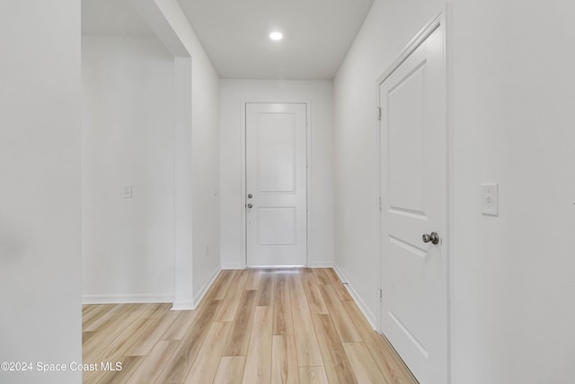 hall with light hardwood / wood-style floors