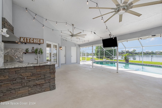 view of pool with ceiling fan, sink, french doors, and a grill