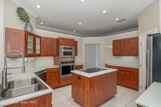 kitchen featuring tasteful backsplash, a center island, appliances with stainless steel finishes, sink, and crown molding