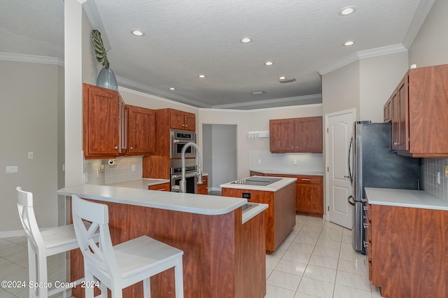 kitchen with light tile patterned floors, backsplash, stainless steel double oven, and a kitchen island