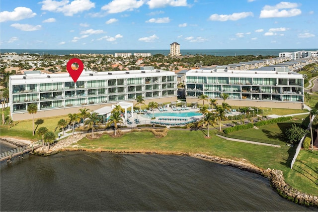 birds eye view of property with a water view