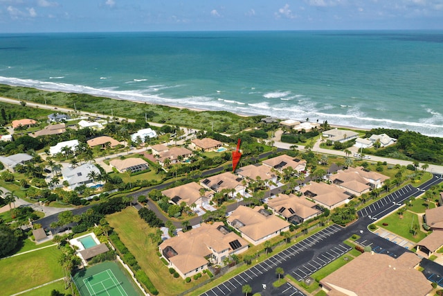 drone / aerial view with a view of the beach and a water view