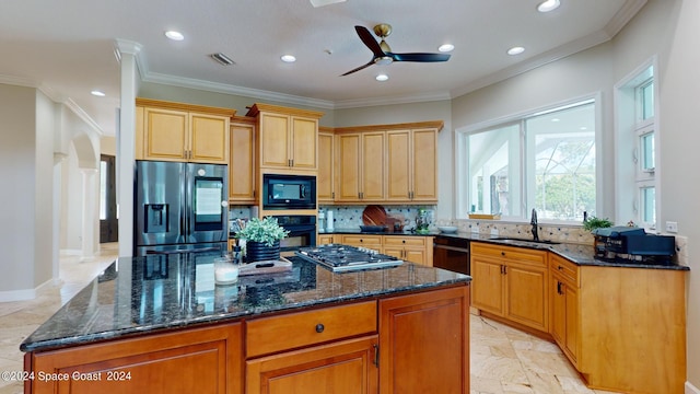 kitchen with light tile patterned floors, a center island, ceiling fan, and black appliances