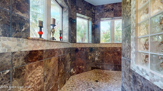 bathroom with tile walls