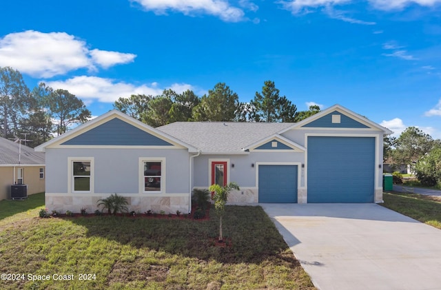 ranch-style home featuring a garage, a front lawn, and central air condition unit