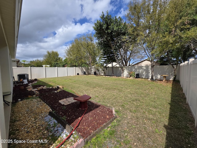 view of yard with a fenced backyard