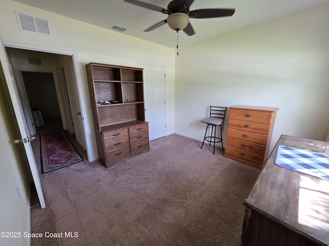 carpeted bedroom featuring visible vents and a ceiling fan