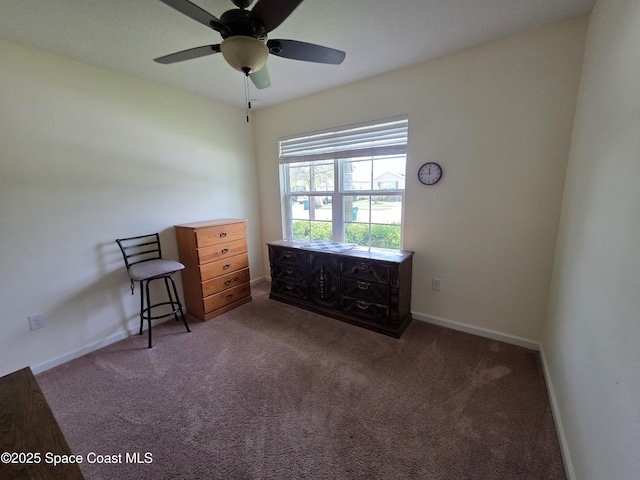 unfurnished bedroom with ceiling fan, carpet floors, and baseboards