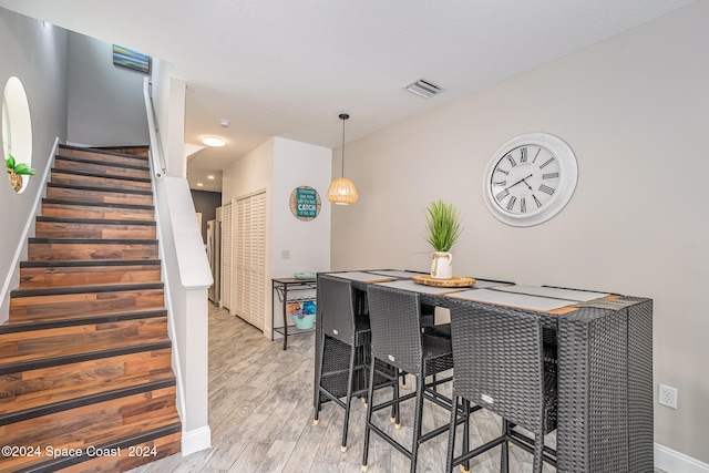 dining room with light hardwood / wood-style floors