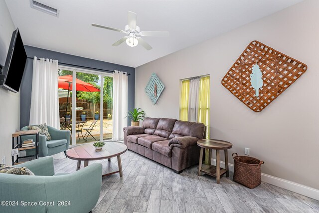 living room with ceiling fan and wood-type flooring