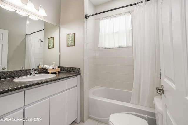 full bathroom featuring tile patterned floors, vanity, shower / tub combo with curtain, and toilet