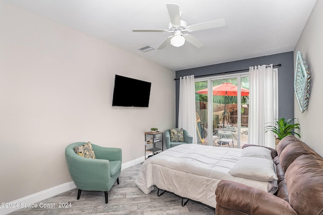 bedroom with ceiling fan, access to outside, and light hardwood / wood-style flooring