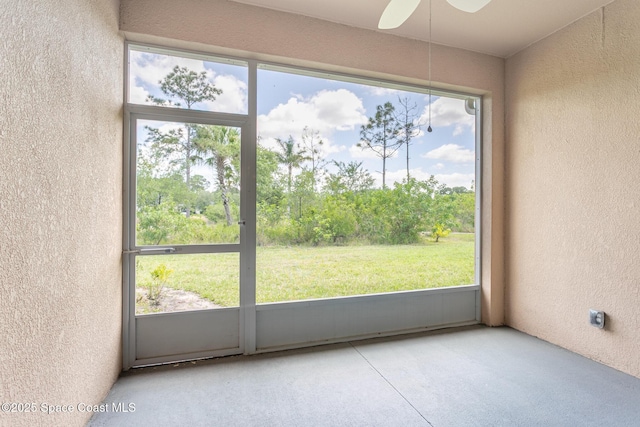 560 Remington Green Dr SE Unit 103, Palm Bay, FL 32909 - interior space featuring a textured wall and a ceiling fan