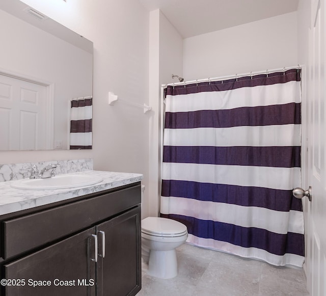 560 Remington Green Dr SE Unit 103, Palm Bay, FL 32909 - full bath featuring visible vents, a shower with shower curtain, toilet, vanity, and tile patterned flooring