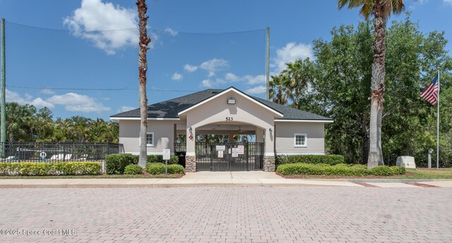 560 Remington Green Dr SE Unit 103, Palm Bay, FL 32909 - view of building exterior featuring fence private yard