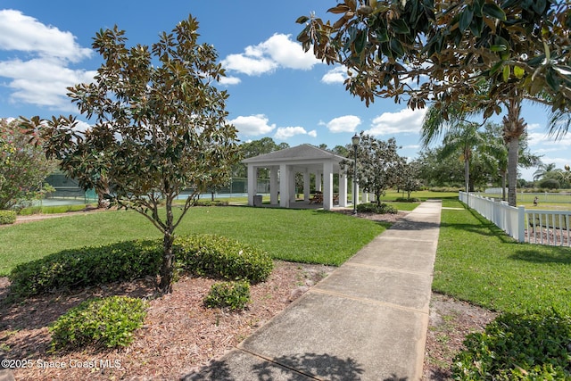 560 Remington Green Dr SE Unit 103, Palm Bay, FL 32909 - view of home's community featuring a gazebo, fence, and a lawn