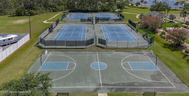 560 Remington Green Dr SE Unit 103, Palm Bay, FL 32909 - view of basketball court with a yard, a tennis court, and fence