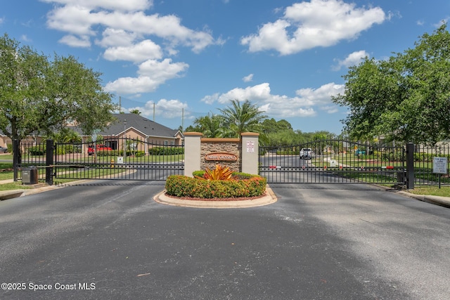 560 Remington Green Dr SE Unit 103, Palm Bay, FL 32909 - view of street featuring a gated entry and a gate