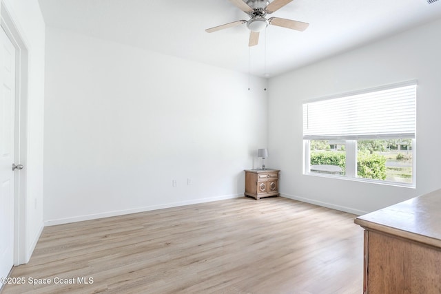 560 Remington Green Dr SE Unit 103, Palm Bay, FL 32909 - spare room featuring light wood finished floors, baseboards, and a ceiling fan