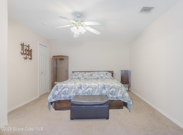 carpeted bedroom featuring ceiling fan, baseboards, and visible vents