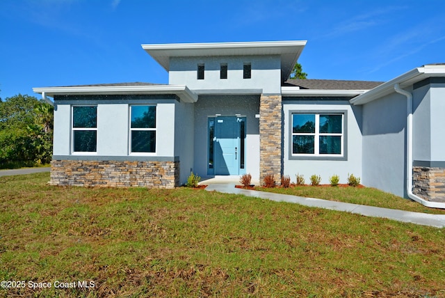 view of front of home with a front lawn