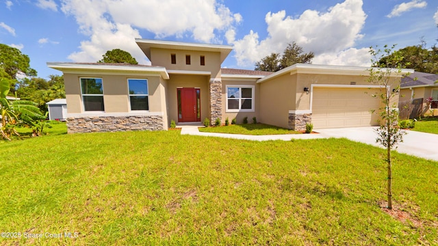 view of front of house with a garage and a front yard