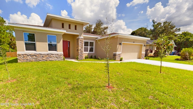 view of front of home with a garage and a front yard