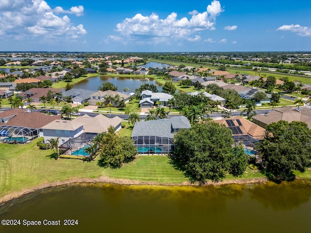 bird's eye view with a water view