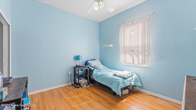 bedroom featuring ceiling fan and hardwood / wood-style flooring