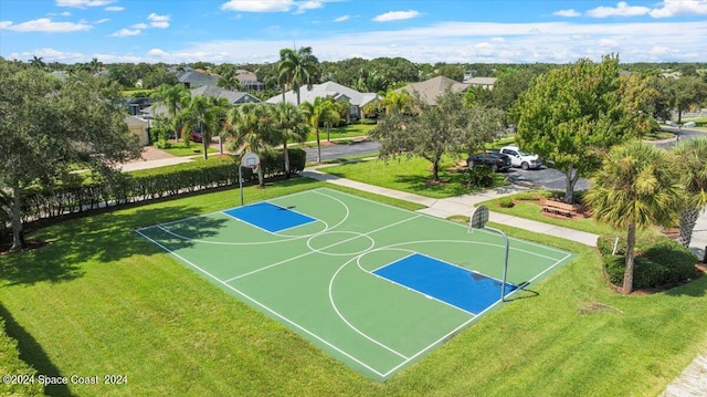 view of basketball court featuring a yard