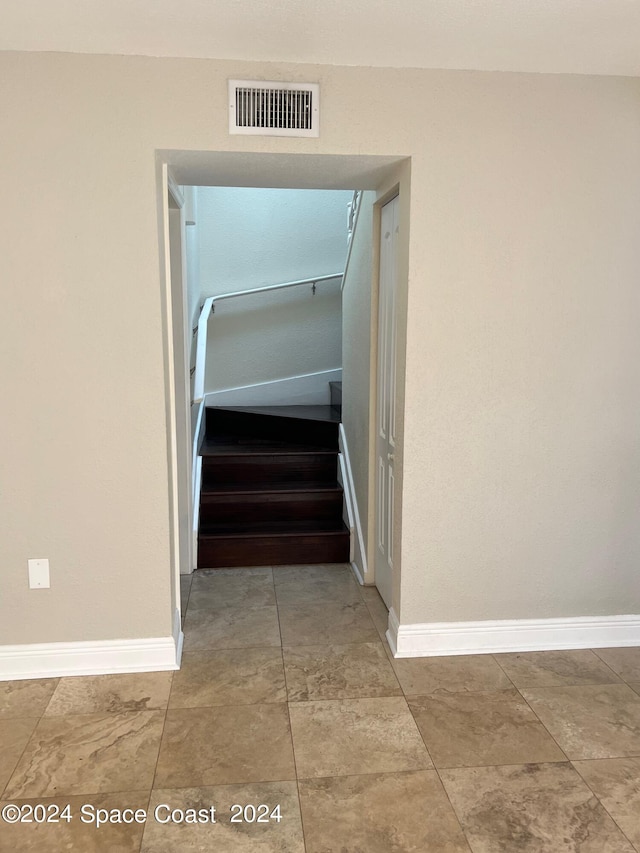 hall featuring tile patterned flooring