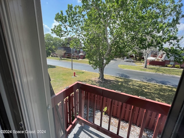 wooden deck featuring a yard