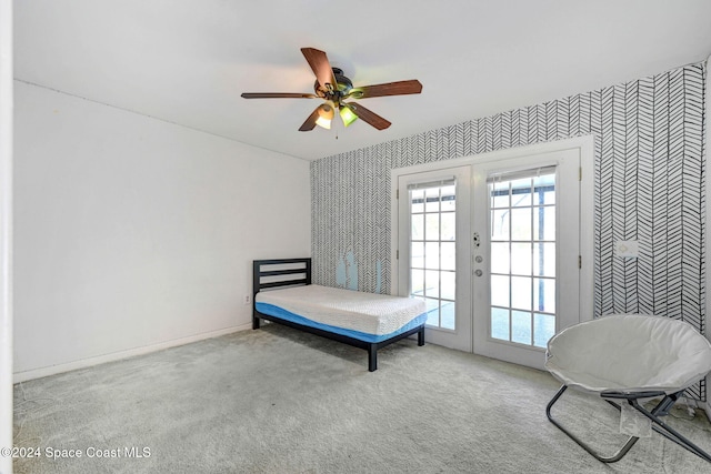 carpeted bedroom with access to outside, french doors, and ceiling fan