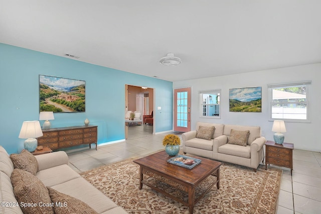 living room with light tile patterned floors