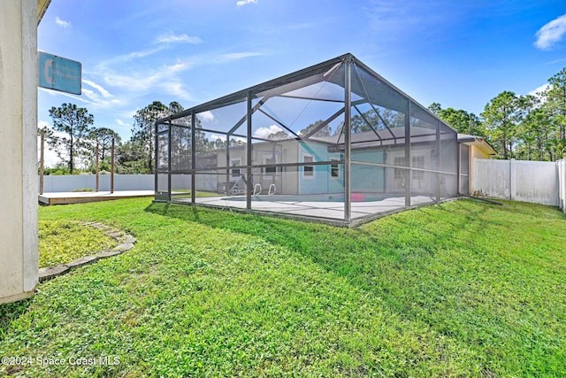 view of yard featuring a lanai, a patio, and a swimming pool