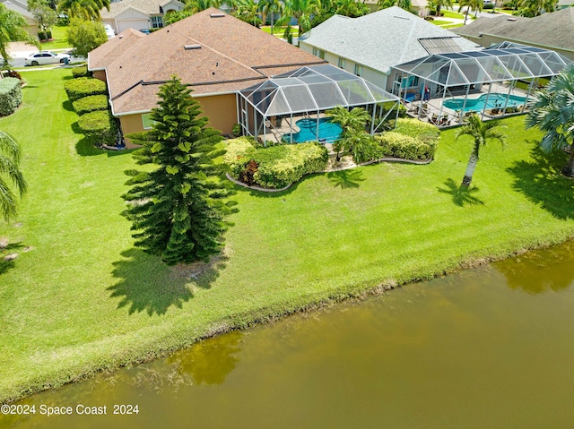 birds eye view of property with a water view