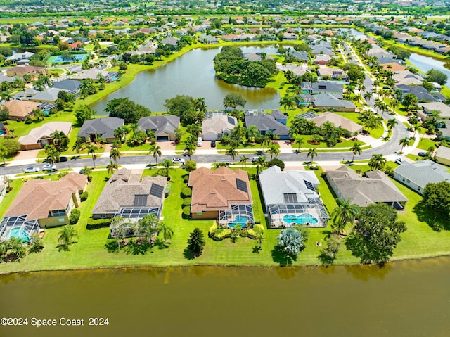 birds eye view of property with a water view