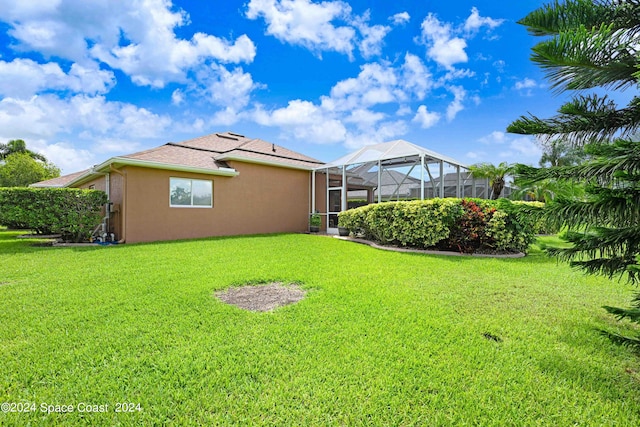 view of yard with a lanai