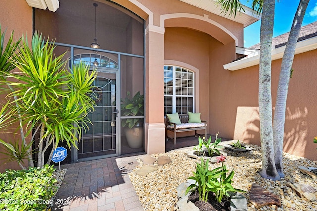 property entrance with a patio area