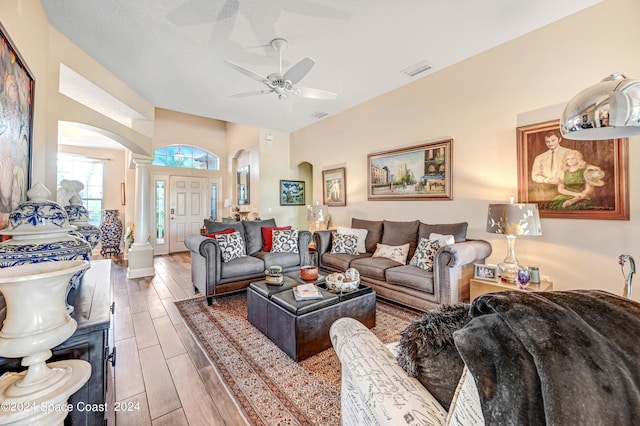 living room featuring ceiling fan and hardwood / wood-style flooring