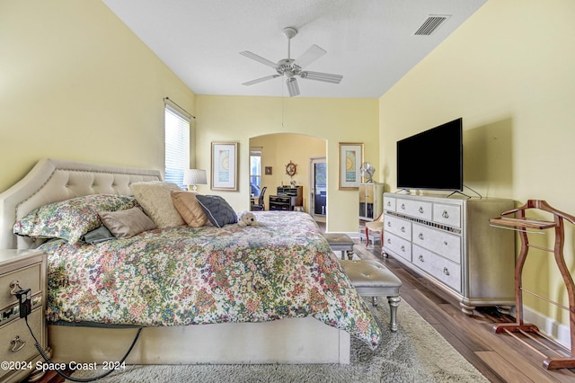 bedroom featuring ceiling fan and dark hardwood / wood-style floors