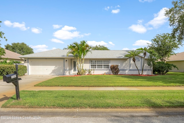 view of front of home with a garage and a front yard